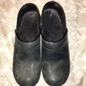 Pair of black leather Dansko shoes.